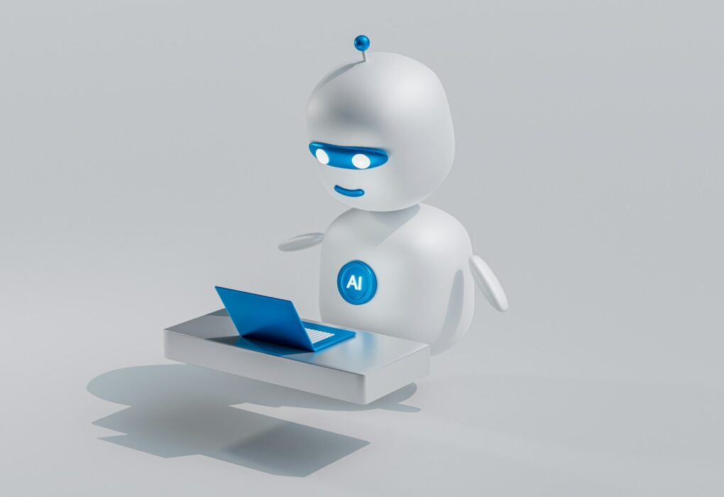a white robot with blue eyes and a laptop